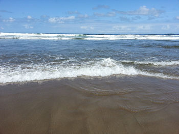 Scenic view of beach against sky