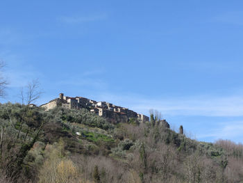 Built structure on land against sky