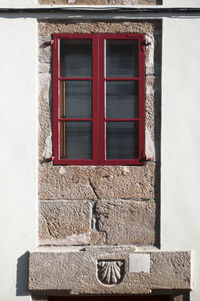 Window on white wall of building