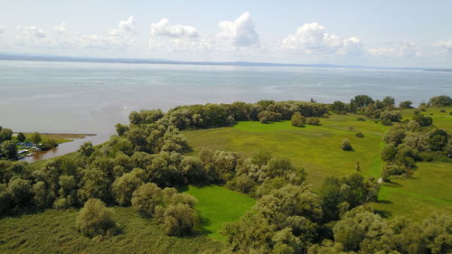 Scenic view of agricultural landscape against sky