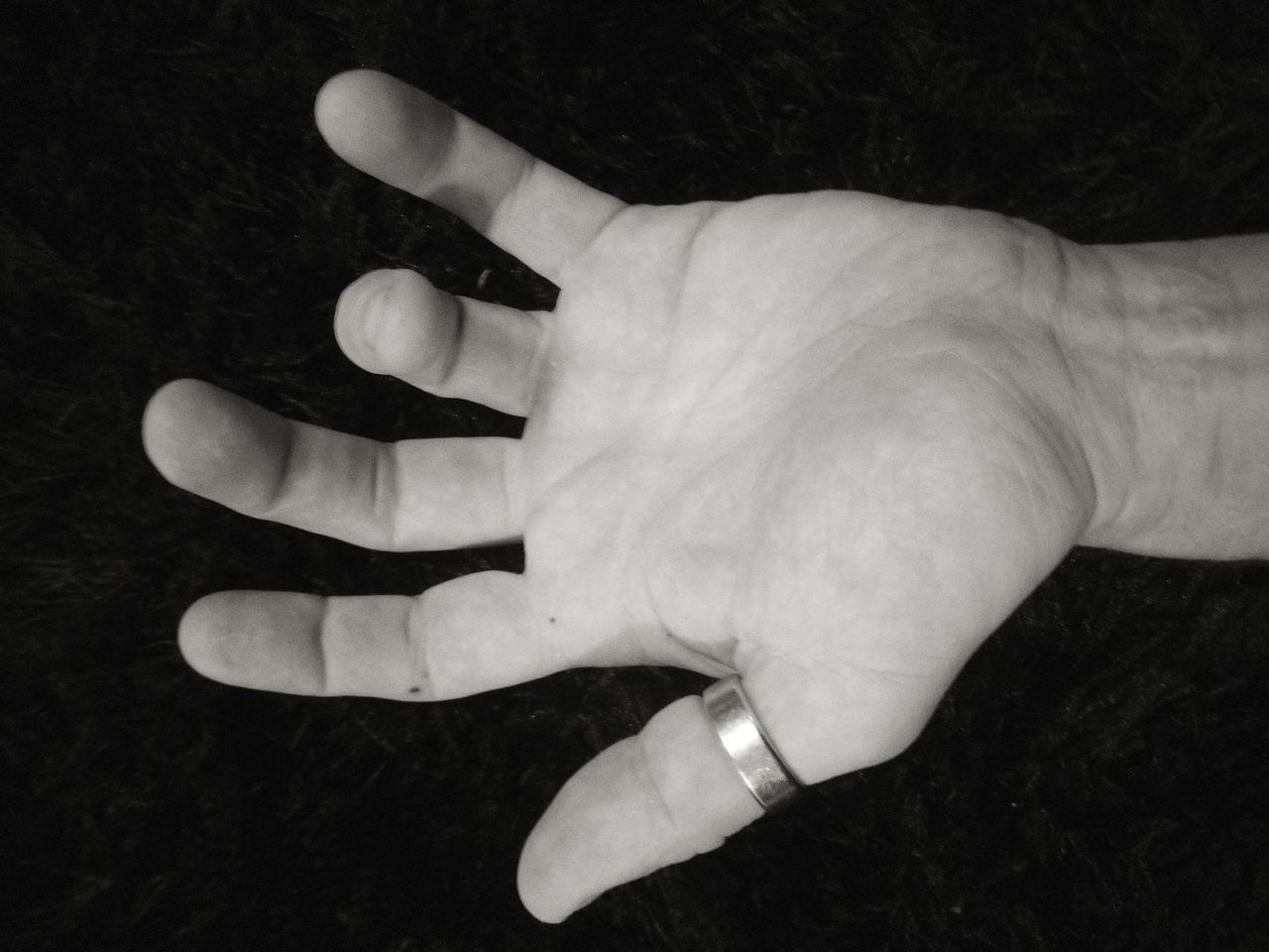 CLOSE-UP OF PERSON HAND WITH TEXT ON HUMAN FACE