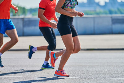 Running women. sport women jogging in sportswear on city road. healthy lifestyle, fitness hobby