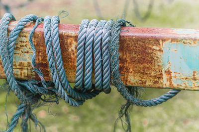 Close-up of rope tied on wooden post