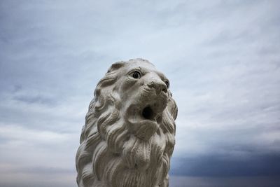 Low angle view of statue against sky