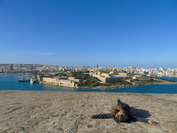 Scenic view of cityscape against clear blue sky