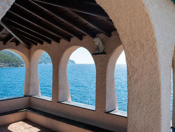 View of sea seen through window