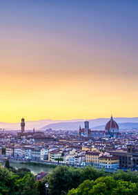 High angle view of buildings against sky during sunset