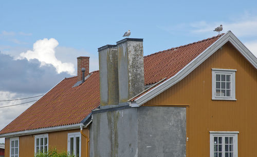 Low angle view of residential building against sky