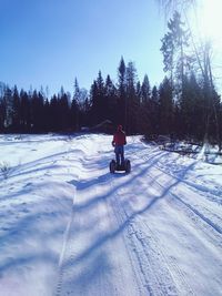 Person standing on snow covered field