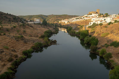 View of the alentejo town of mértola with the guadiana river in evidence.