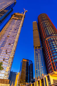 Low angle view of modern buildings against sky