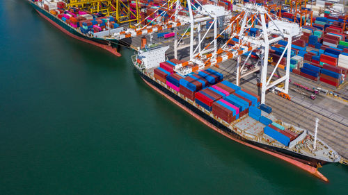 Aerial view container ship at commercial dock, company import export global business trade logistic