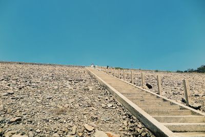 View of road against clear blue sky