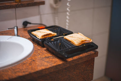 High angle view of a sandwich maker on table