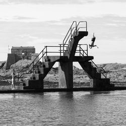 Person jumping off diving platform