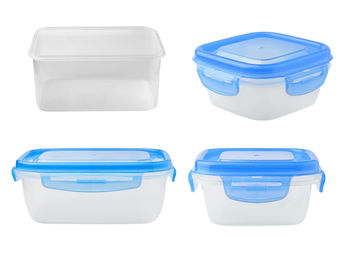 Close-up of plastic containers over white background