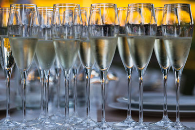 Close-up of wine glasses on table