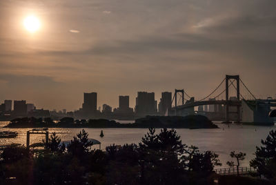 Silhouette of city at waterfront