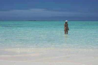 Full length of man standing on beach