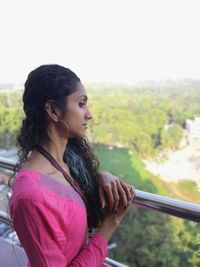 Portrait of a young woman looking away