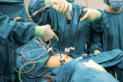 Midsection of man working in bikini