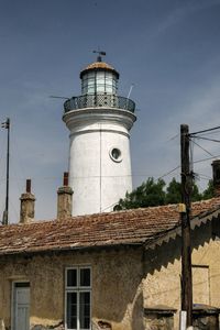 Low angle view of lighthouse against sky