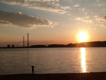 Scenic view of lake against sky during sunset