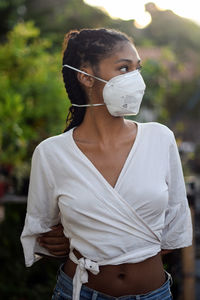 Young black woman in face mask