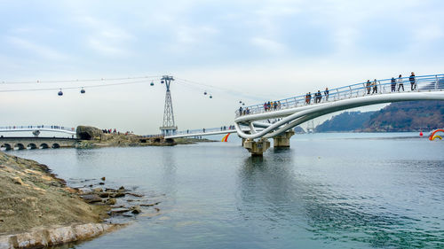 Bridge over river against sky