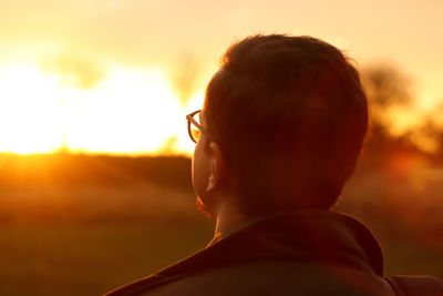 Silhouette of man looking at sunrise. mental health, hope, happiness concept. open mind, new goals 