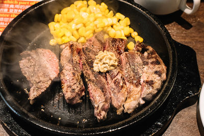 High angle view of meat in cooking pan