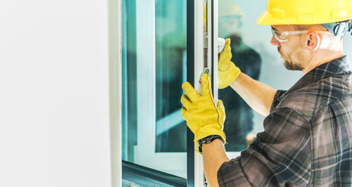 Side view of man working in office