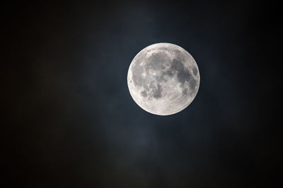 Low angle view of moon against sky at night