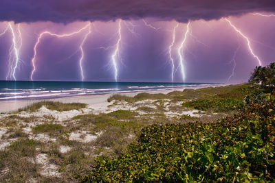 Lightning in sky over sea