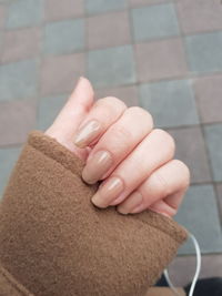 Close-up of woman hand on wall