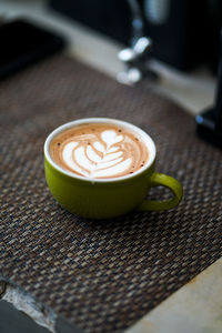 Close-up of cappuccino on table