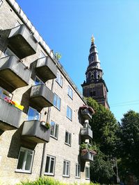 Low angle view of building against clear blue sky