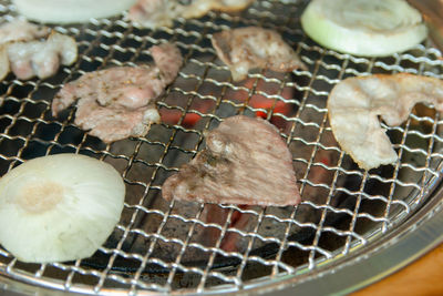 High angle view of meat on barbecue grill