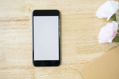 Low angle view of smart phone on table