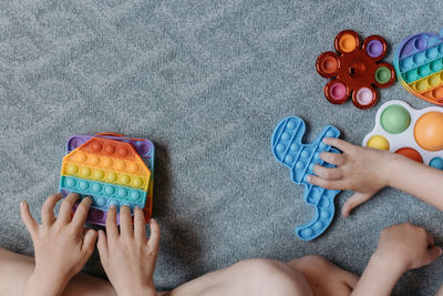 High angle view of woman holding toy toys