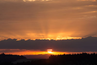 Scenic view of dramatic sky during sunset