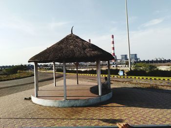 Built structure on beach against sky in city