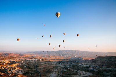 Hot air balloons at cappadocia against sky