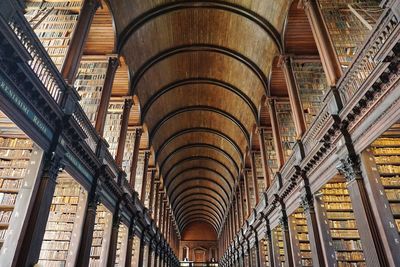 Low angle view of ceiling of library building in dublin
