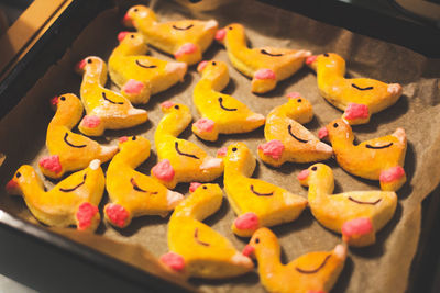 Close-up of duck shape sweet food in tray