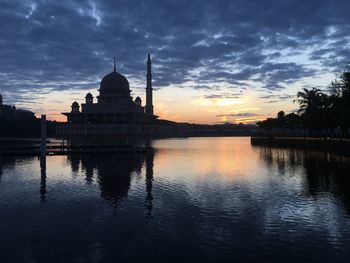 Reflection of church in lake during sunset