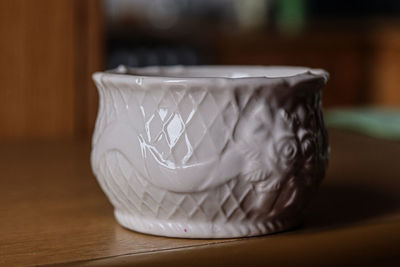Close-up of coffee cup on table