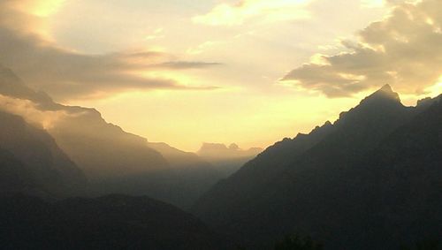 Scenic view of mountains against sky during sunset
