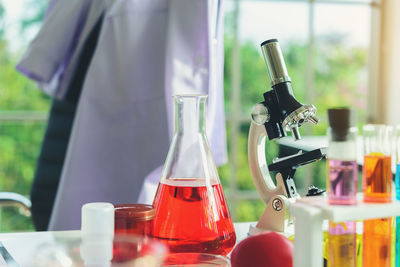 Close-up of test tubes and beaker at laboratory