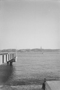 Pier over sea against clear sky